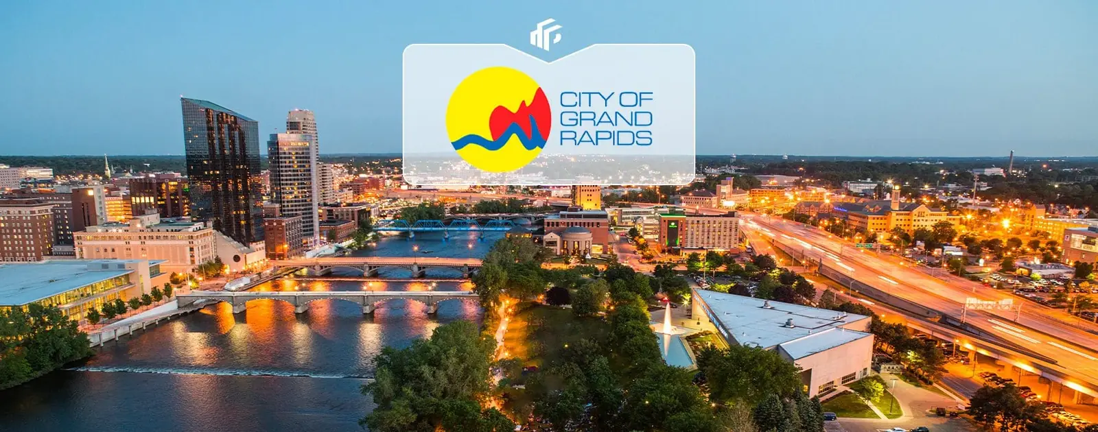 Downtown Grand Rapids, Michigan at dusk, seen from the air over the Grand River
